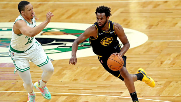 Andrew Wiggins drives past Grant Williams in the NBA Finals.